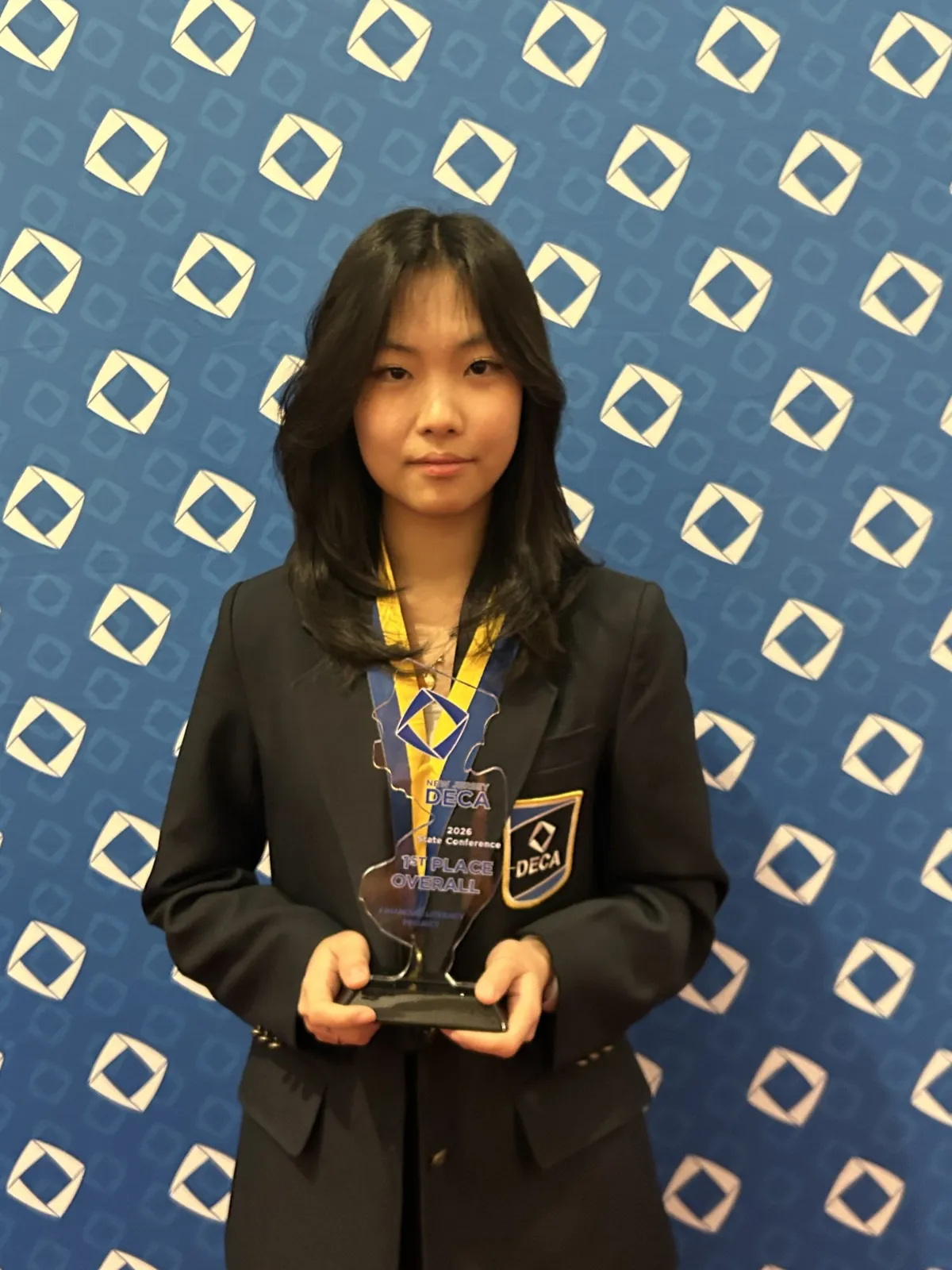Grace Zhou with the first-place trophy at NJ DECA States