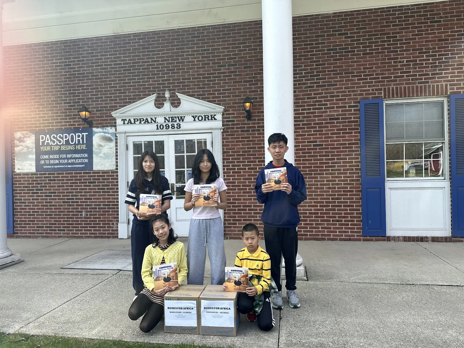 FinGoose team with boxes of books for Books for Africa