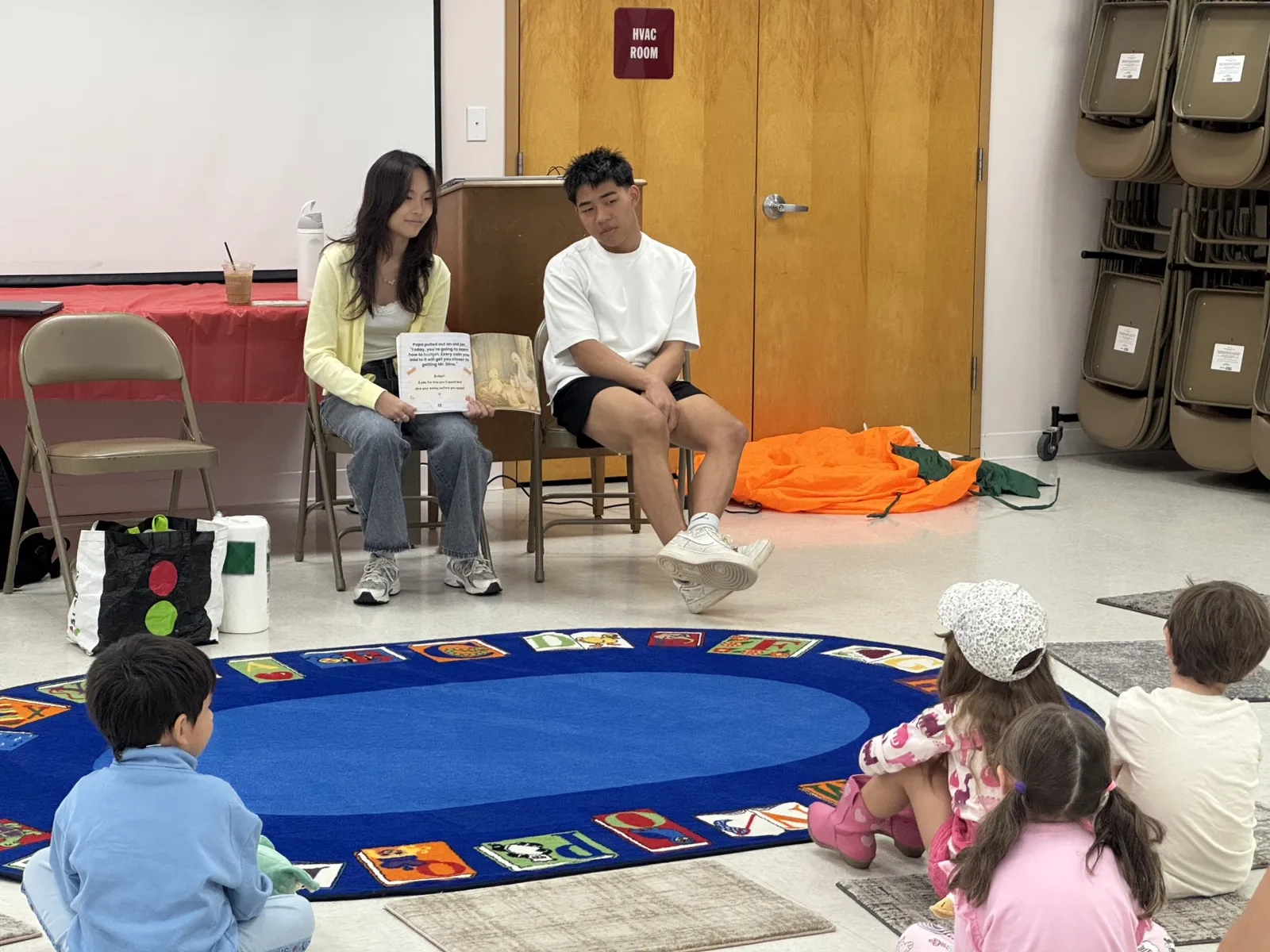 FinGoose team reading aloud to kids at Leonia Public Library